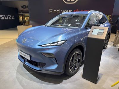 Sleek aerodynamic front and sharp headlights of modern electric SUV