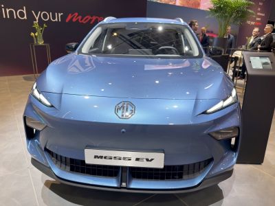 Sleek front view with LED headlights and bold grille design.