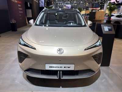 Sleek front view with narrow LED headlights and aerodynamic fascia