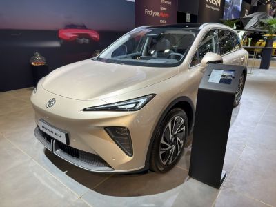 Sleek electric SUV front with slim LED headlights and aerodynamic design