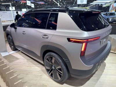 Rear side view of a matte-finished SUV with LED taillights and black roof