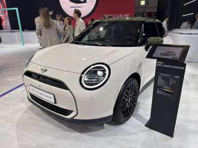 Front view with round LED headlights and distinctive grille design