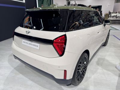 Rear and side view of electric hatchback with unique taillights and black roof