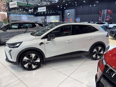 White electric SUV side view with sleek design and alloy wheels