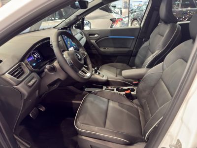 Modern dashboard with digital displays and premium leather front seats