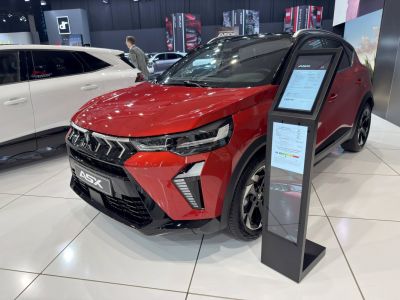 Sporty front grille and sleek LED headlights with modern SUV styling.