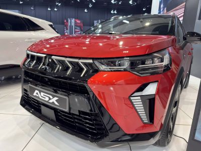 Close-up of front grille and headlight design with angular styling and LED elements