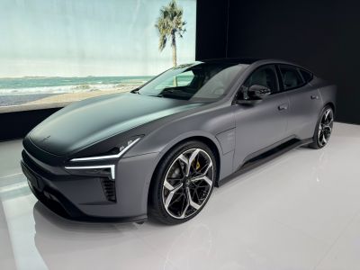 Sharp LED headlights and polished alloy wheels on an aerodynamic luxury sedan.