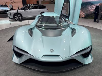 Futuristic electric sports car front with butterfly doors
