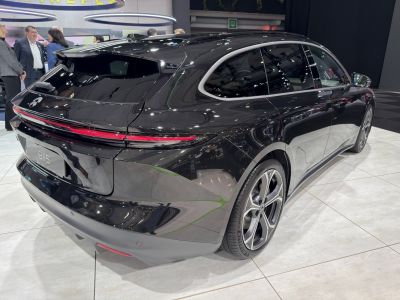 Sleek rear design and continuous LED taillights on a touring hatchback