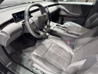 Modern digital dashboard and premium leather front seats interior