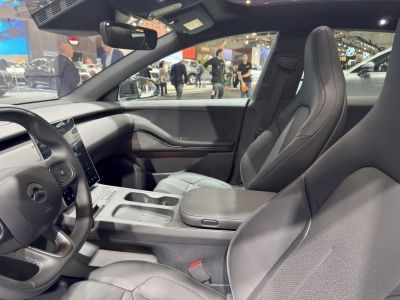 Modern front seats and touchscreen display in a sleek car interior