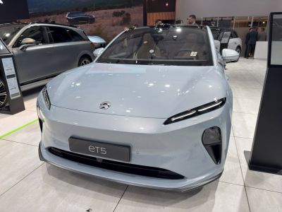 Sleek front view with aerodynamic hood and slim headlights