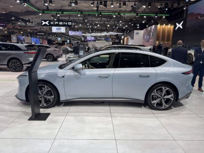 Sleek electric sedan with aerodynamic shape and flush door handles.