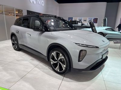 Modern electric SUV with aerodynamic shape and distinctive LED lights