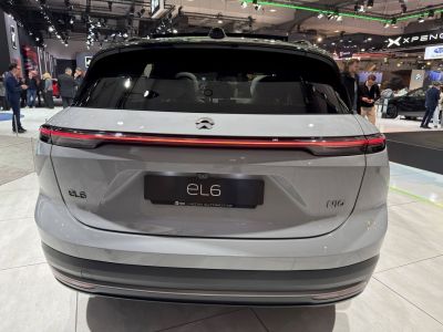 Rear view with continuous LED tail light and smooth rear hatch.