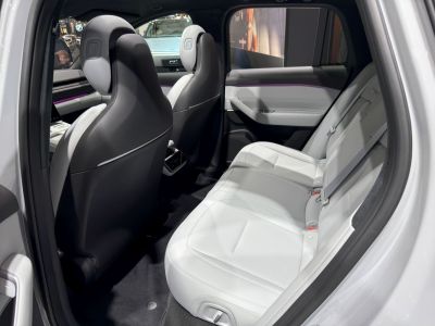 Spacious rear seats with premium upholstery and ambient purple lighting
