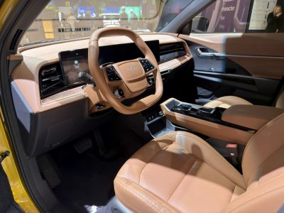 Digital dashboard and brown leather seats in modern car interior