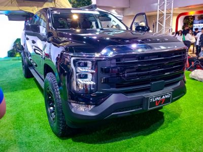 Bold black front grille with unique LED headlights on rugged pickup.