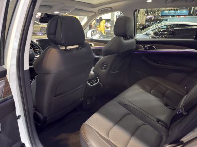 Spacious leather rear seats with ambient lighting and ventilation controls.