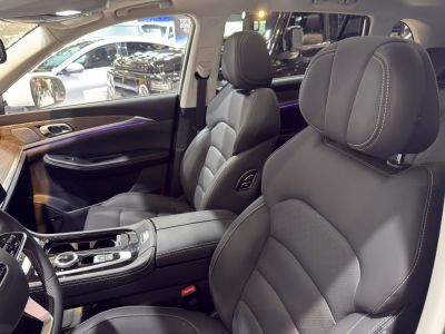 Luxury front seat interior with leather upholstery and modern center console
