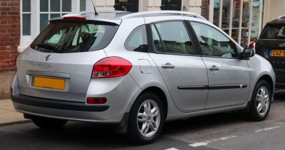 Rear and side view of silver station wagon with distinct tail lights