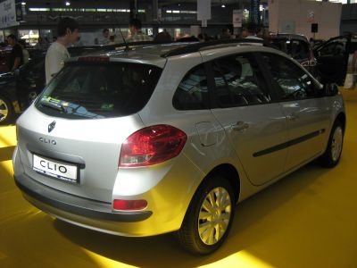 Silver compact hatchback rear-side with roof rails and taillights