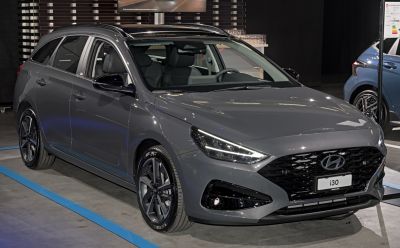 Sleek front view with modern grille and sporty alloy wheels