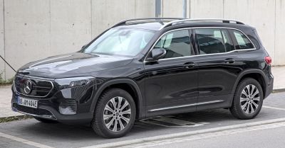 Black electric SUV with LED headlights and roof rails