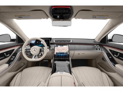 Luxury car interior with beige leather seats and advanced digital displays