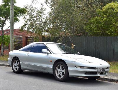 silver sports coupe, aerodynamic design, five-spoke alloy wheels