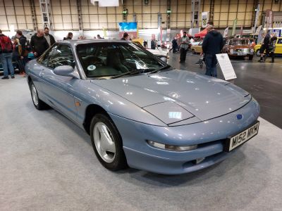 Aerodynamic sports coup&eacute; with pop-up headlights and alloy wheels