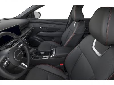 Leather seats with red stitching and modern dashboard with steering wheel controls