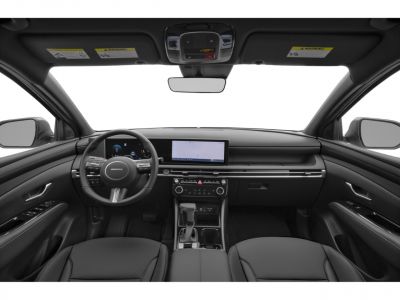 Modern car interior with digital displays and sleek dashboard.