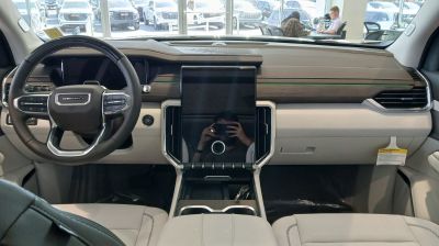Luxury SUV interior with digital dashboard and large central touchscreen