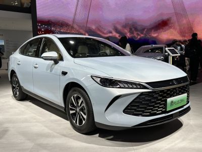 Sleek front grille and sharp LED headlights of a modern sedan