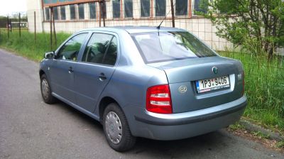 Rear view of sedan with classic tail lights and roof antenna