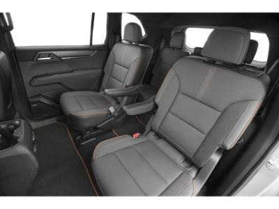 Rear seats with armrest and contrasting stitching in a modern SUV