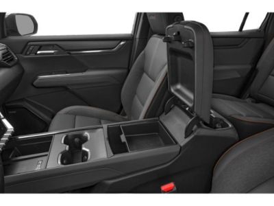 Spacious interior center console and seating with modern design.