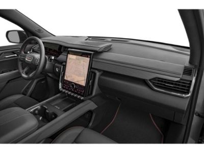 Modern SUV interior with large vertical touchscreen and digital dashboard