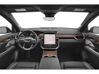 Modern dashboard with large vertical touchscreen and wood trim accents