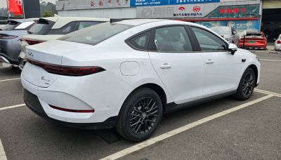 Sleek rear and side profile with narrow taillights and black alloy wheels
