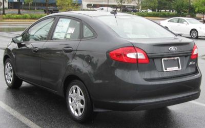 Rear view of compact sedan with taillights and trunk