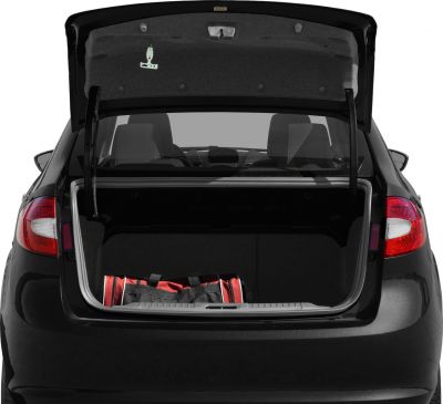 Open trunk with spacious cargo area and red duffle bag inside compact sedan