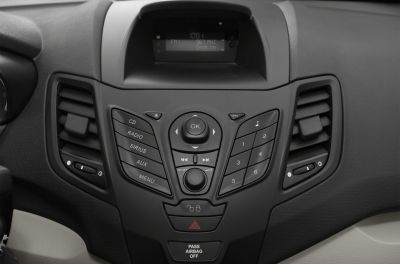 Car center console with audio controls and air vents