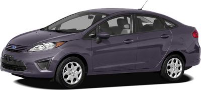 Compact sedan front side view, sleek headlights, alloy wheels