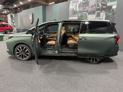 Sliding rear door with tan leather seating interior