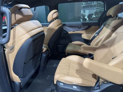 Luxurious tan leather rear seats with ergonomic design and premium comfort features