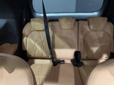 Beige leather rear seats with headrests and seat belts