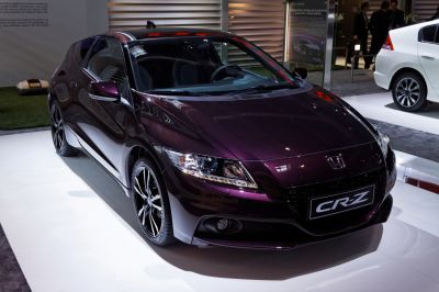Front and side view with sleek headlights and alloy wheels